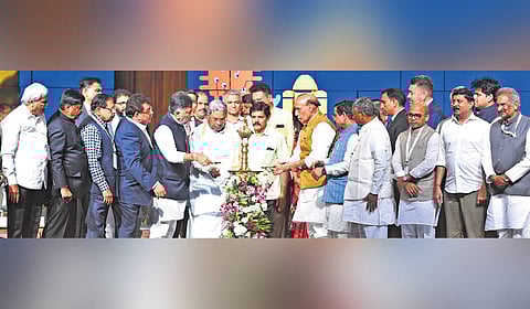 Defence Minister Rajnath Singh, along with Chief Minister Siddaramiah and Karnataka ministers, inaugurates the Invest Karnataka 2025 Global Investors Meet at Bengaluru Palace Grounds on Tuesday.