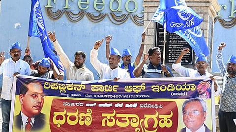 Members of the Republican party of India protest the Metro train ticket hike at Freedom Park.