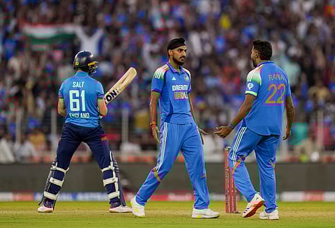 Arshdeep Singh celebrates with Harshit Rana after taking the wicket of England's Phil Salt during the third ODI between India and England at the Narendra Modi Stadium in Ahmedabad (Photo | PTI)