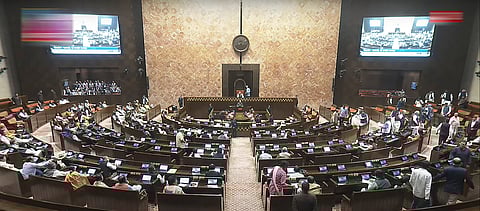 Opposition members walk out of the Rajya Sabha during the Budget session of Parliament, in New Delhi, Thursday, Feb. 13, 2025.