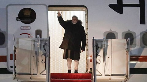 India's Prime Minister Narendra Modi waves from the stairs of his plane upon his arrival at Joint Base Andrews, Md., Wednesday, Feb. 12, 2025. 