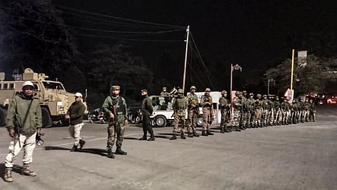 Security personnel stand guard in Imphal East, Manipur.
