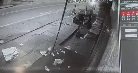 CCTV footage showing a cat carrying a piece of meat in its mouth 