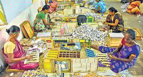 Workers packing safety matches 