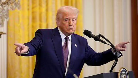 US President Donald Trump points to a reporter and India's Prime Minister Narendra Modi during a news conference in the East Room of the White House, Thursday, Feb. 13, 2025, in Washington.