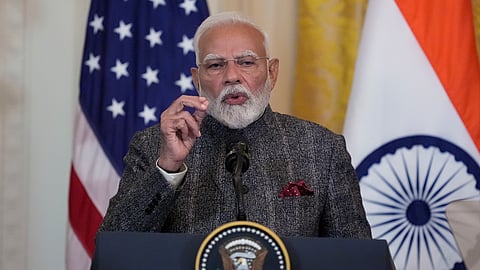 Prime Minister Narendra Modi speaks during a news conference with US President Donald Trump in the East Room of the White House, Thursday, Feb. 13, 2025, in Washington.