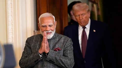 In this Feb. 13, 2025 photo, Prime Minister Narendra Modi, left, and US President Donald Trump arrive for a news conference in the East Room of the White House, in Washington.