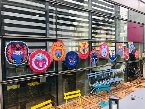 Julie Stephen Chheng's AR exhibition, 'Uramado,' invites participants on a treasure hunt to discover hidden Tanuki spirits scattered throughout the venue.