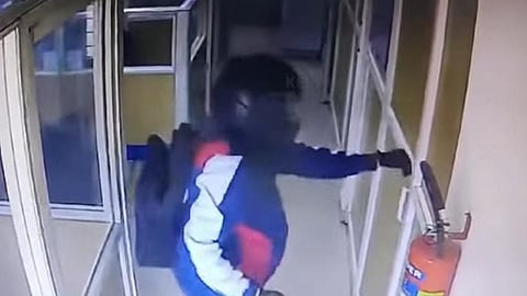 CCTV footage of the man leaving the bank after robbing it