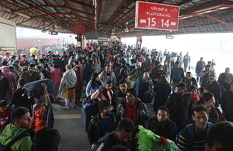 Passengers in a large number at the New Delhi railway station, Sunday, Feb. 16, 2025. 