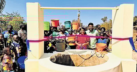 Arun and his wife Sumi along with villagers near a ‘Kerala model’ well in Malawi, Africa
