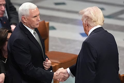 Donald Trump, right, shakes hands with former Vice President Mike Pence before the state funeral for former President Jimmy Carter at Washington National Cathedral in January (Photo | AP)