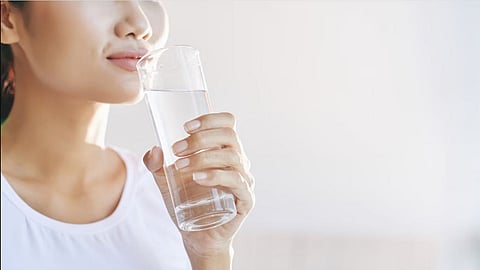 Representative picture of a woman drinking water