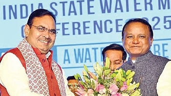 Rajasthan CM Bhajan Lal Sharma greets  Mohan Charan Majhi at the conference