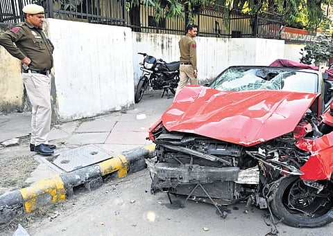 According to police, the high speeding red Audi first struck the scooter before crashing into a tree. 