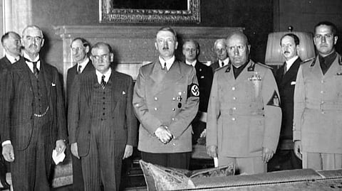 (From left to right): Neville Chamberlain, Édouard Daladier, Adolf Hitler, Benito Mussolini, and Italian Foreign Minister Galeazzo Ciano before signing the Munich Agreement, which gave the Sudetenland to Germany.