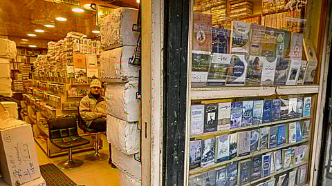 A shopkeeper waits for customers at a bookshop in Srinagar on February 18, 2025.
