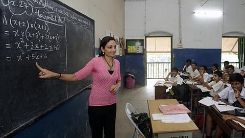 Representational image of a teacher in a classroom 
