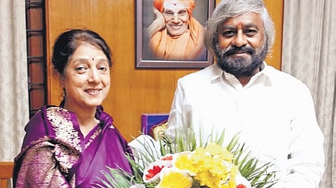 Forest Minister Eshwar Khandre greets newly appointed PCCF Meenakshi Negi in Bengaluru on Thursday