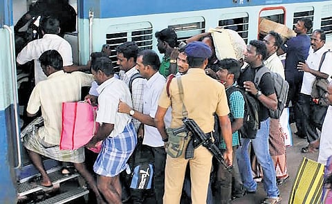 People rushing to board a train