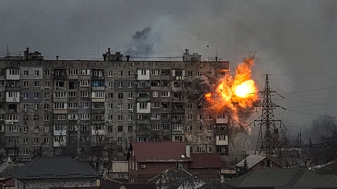 An explosion erupts from an apartment building at 110 Mytropolytska Street, after a Russian army tank fired on it in Mariupol, Ukraine, March 11, 2022.