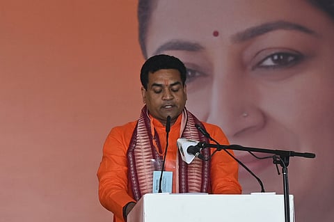 Kapil Mishra takes oath as a Minister during the swearing-in ceremony of the BJP-led government in New Delhi. 