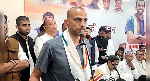RJD leader and Leader of Opposition in Bihar Assembly Tejashwi Yadav addresses INDIA bloc press conference, in Patna, Thursday, Oct. 23, 2025. Congress leader Ashok Gehlot is also seen.