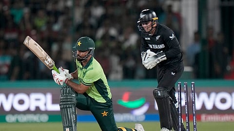 Pakistan's Fakhar Zaman, left, is bowled out by New Zealand's Michael Bracewell during the ICC Champions Trophy cricket match between Pakistan and New Zealand, in Karachi, Pakistan Wednesday, Feb. 19, 2025.