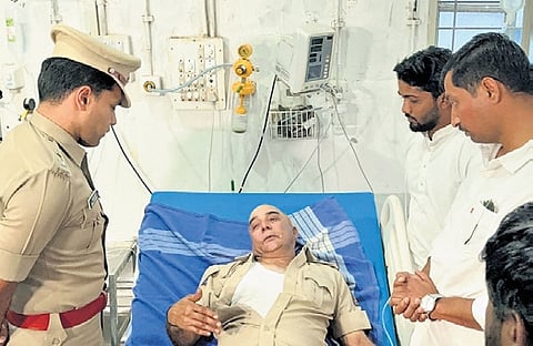 DCP Rohan Jagadish visits KSRTC bus conductor Mahadev Hukkeri at Belagavi civil hospital on Friday  