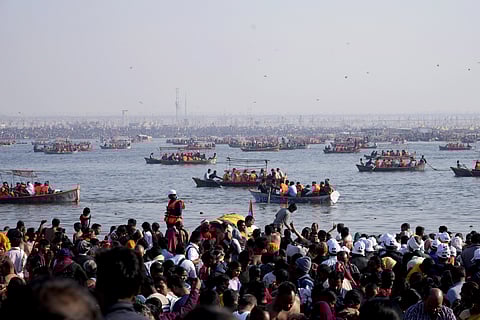 Hindu devotees gather on the banks to take ritualistic holy dips at the Sangam, the confluence of Rivers Ganges, Yamuna and mythical Saraswati, during the Mahakumbh festival 