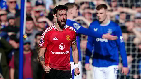 Manchester United's Bruno Fernandes celebrates scoring his side's first goal during the English Premier League match against Everton at Goodison Park 