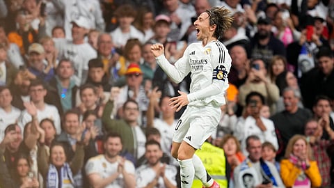Real Madrid's Luka Modric celebrates after scoring the opening goal during the Spanish La Liga football match between Real Madrid and Girona at the Santiago Bernabeu stadium in Madrid, Spain.