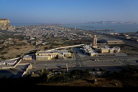 A view of newly developing area, bottom, and downtown area seen from a hilltop in the coastal city of Gwadar, in the southwest Pakistani province of Balochistan