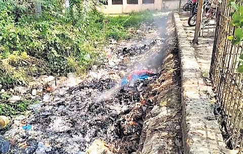 Burnt biomedical waste on the premises of MKCG Medical College and Hospital