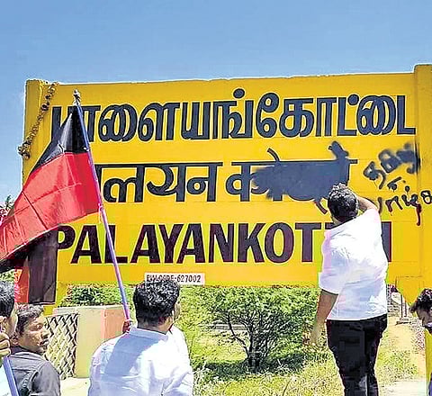 Groups of DMK cadre defaced the Hindi lettering on name boards at the Palayamkottai railway station (left) in Tirunelveli district and Pollachi junction in Coimbatore district on Sunday 