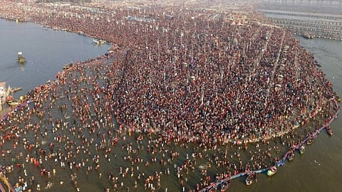 Devotees take holy dip at the Mahakumbh.