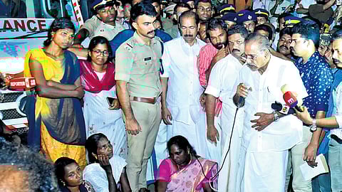 Forest Minister A K Saseendran speaks to local residents after paying tributes to the couple, Velli and Leela, who were trampled to death by a wild elephant at Aralam farm on Sunday