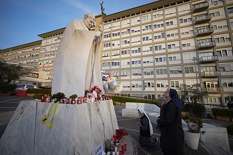 Nuns pray for Pope Francis in front of the Agostino Gemelli Polyclinic, in Rome, Sunday, Feb. 23, 2025, where the Pontiff has been hospitalized since Friday.