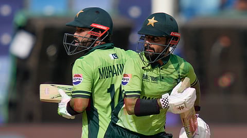 Pakistan's Saud Shakeel, right, and captain Mohammad Rizwan, during the ICC Champions Trophy cricket match between India and Pakistan at Dubai International Cricket Stadium, United Arab Emirates, Sunday, Feb. 23, 2025.