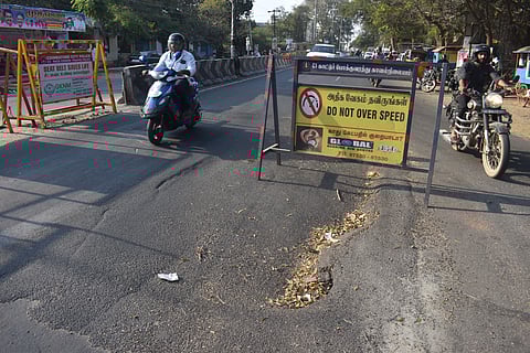  Due to the shoddy repair works carried out by the civic body officials on the Pankaja Mill Road in the city, the freshly paved road has caved in once again. The officials have installed safety barricades around the caved in portion on the road to prevent any mishaps.