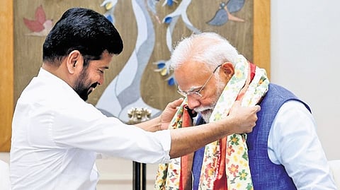 Chief Minister A Revanth Reddy greets Prime Minister Narendra Modi in New Delhi on Wednesday