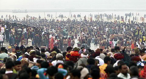 Pilgrims take a holy dip at Sangam, the confluence of Ganges, Yamuna and mythical Saraswati rivers, on the occasion of Maha Shivaratri during the Maha Kumbh Mela festival in Prayagraj on February 26, 2025.