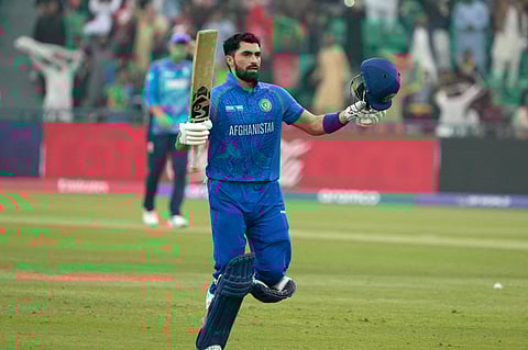 Afghanistan's Ibrahim Zadran celebrates after scoring a century during the ICC Champions Trophy match against England in Lahore (Photo | AP)