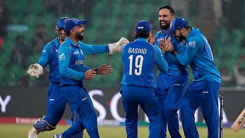 Afghanistan's Mohammad Nabi, second right, celebrates with teammates after dismissal of England's Harry Brook during the ICC Champions Trophy cricket match between Afghanistan and England, in Lahore, Pakistan, Wednesday, Feb. 26, 2025.
