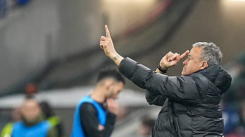 PSG's head coach Luis Enrique gives instructions to his players during the French League One soccer match between Lyon and Paris Saint-Germain at the Groupama stadium, outside Lyon, France, Sunday, Feb. 23, 2025.