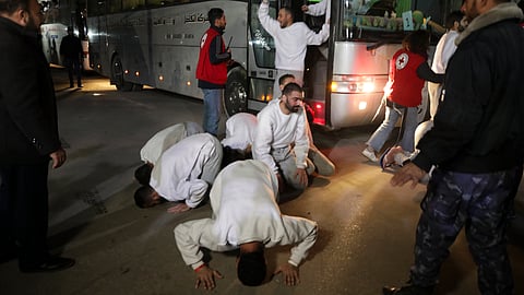 Freed Palestinian prisoners react as they arrive in the Gaza Strip after being released from an Israeli prison following a ceasefire agreement between Hamas and Israel in Khan Younis, Gaza Strip, Thursday, Feb. 27, 2025.