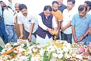 CM Mohan Charan Majhi pays tributes to the mortal remains of Uttam Mohanty.