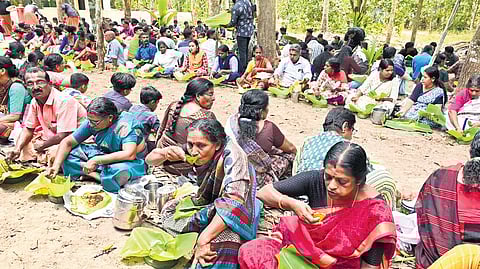 Devotees partake of the kuthiramootil kanji offering in Chettikulangara on Thursday