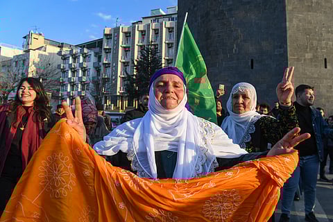 A supporter flashes a victory sign after jailed leader of the Kurdistan Workers' Party (PKK) Abdullah Ocalan, 75, called on the Kurdistan Workers' Party (PKK) to disarm and dissolve itself in Diyarbakir, southeastern Turkey, on February 27, 2025.