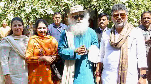 Karnataka Deputy Chief Minister DK Shivakumar (right) and his family members with spiritual leader Jaggi Vasudev (second right) at the Isha Yoga Centre in Coimbatore.
